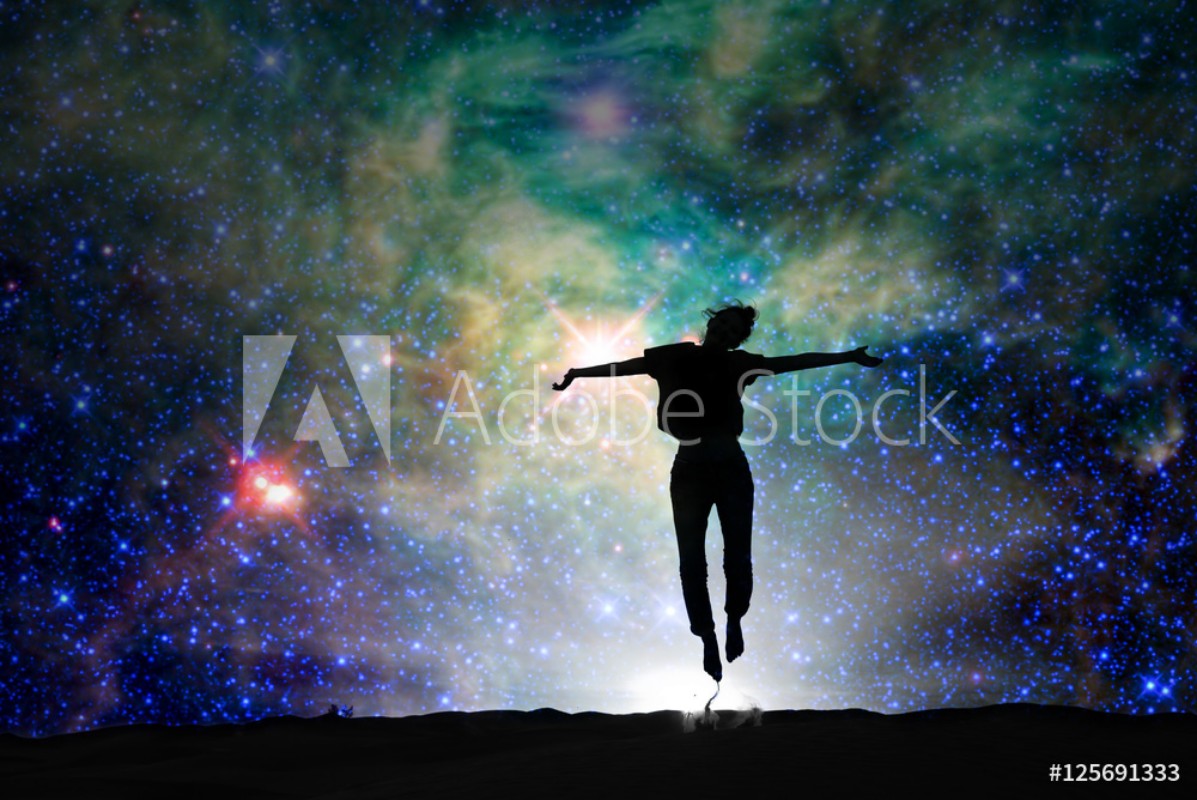 Bild på Silhouette of a woman jumping starry night background